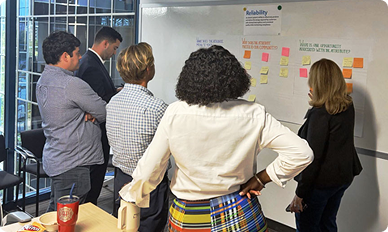 people in front of white board